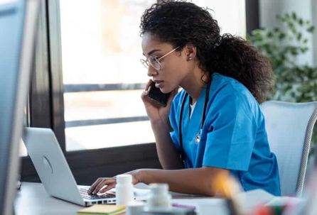 Young female doctor working on computer