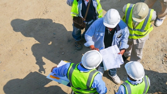 Aerial view group of construction worker meeting at construction site