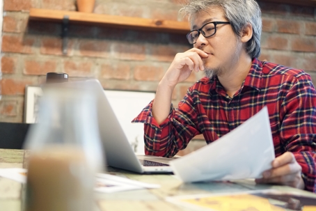 man looking at laptop