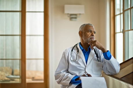 Doctor thinking about new AKS and Stark Law regulations.