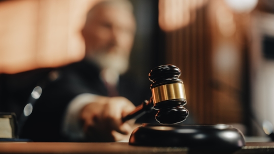 Judge pronouncing judgment, striking gavel