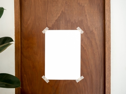 Blank poster taped to office door.