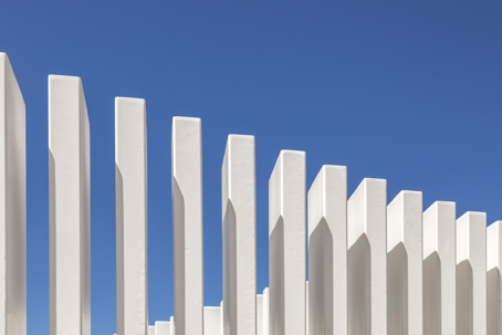 white fence in front of the sky