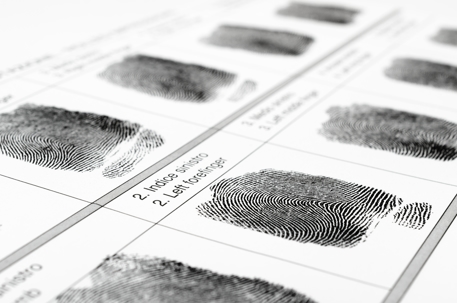 Close-up of fingerprints on a paper form