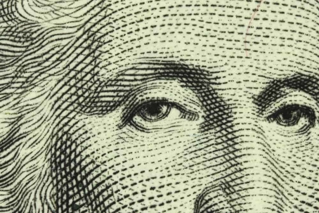 Close-up of the portrait of George Washington on the US dollar bill.