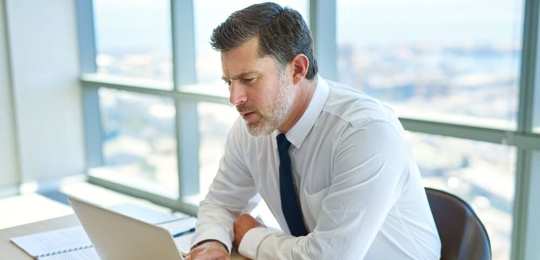 Business man looking stressed over contract dispute.