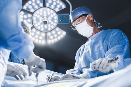 Group of surgeons at operation in operating room