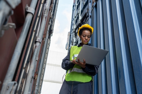 Worker at shipping container yard