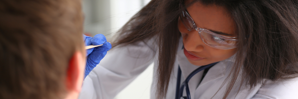 A physician examining a patient